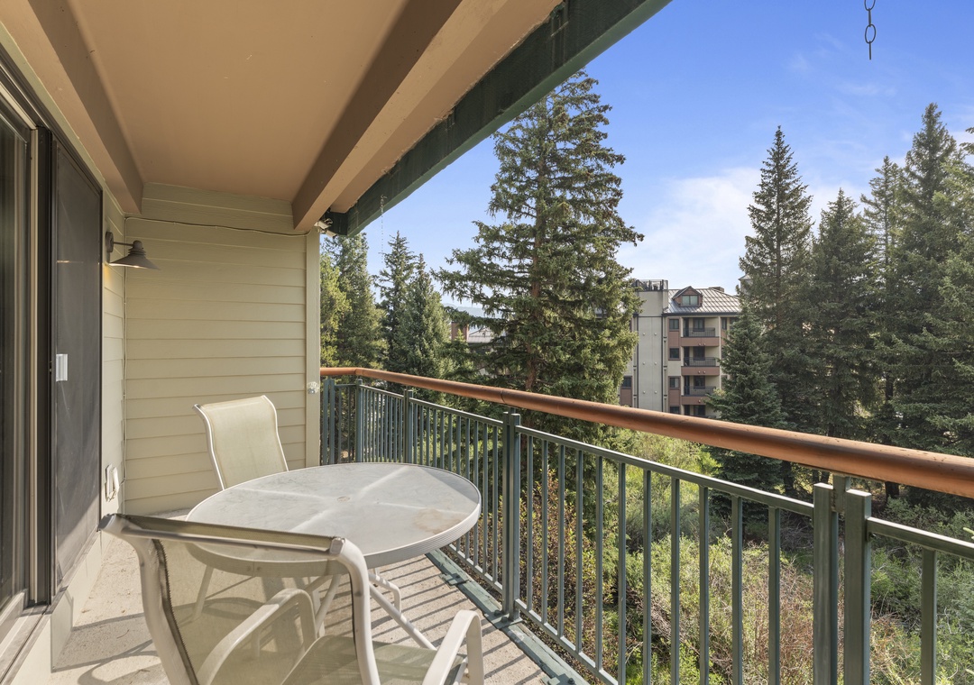 Step out onto your private balcony and take in fresh mountain air, surrounded by tall evergreens and peaceful treetop views—perfect for morning coffee or unwinding after adventure.