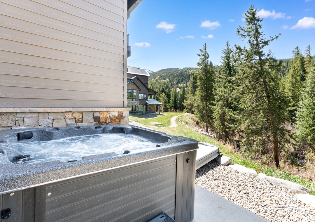 Soak in your private hot tub overlooking forested mountains and alpine meadows—a perfect mountain escape.