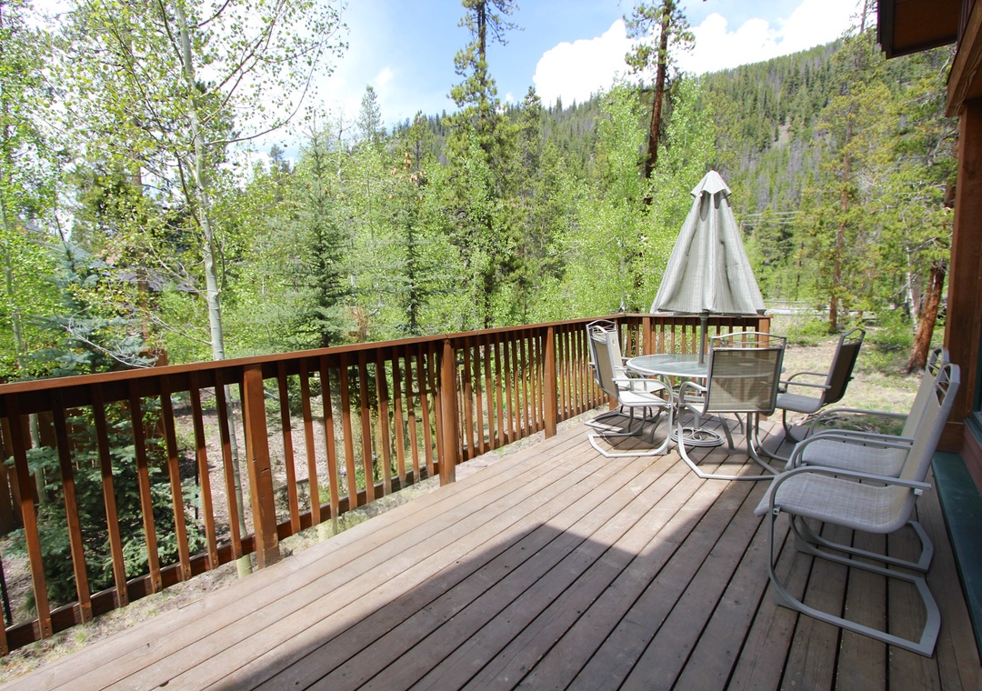 Unwind on your private deck surrounded by towering pines and mountain vistas, where morning coffee and evening conversations become unforgettable moments.