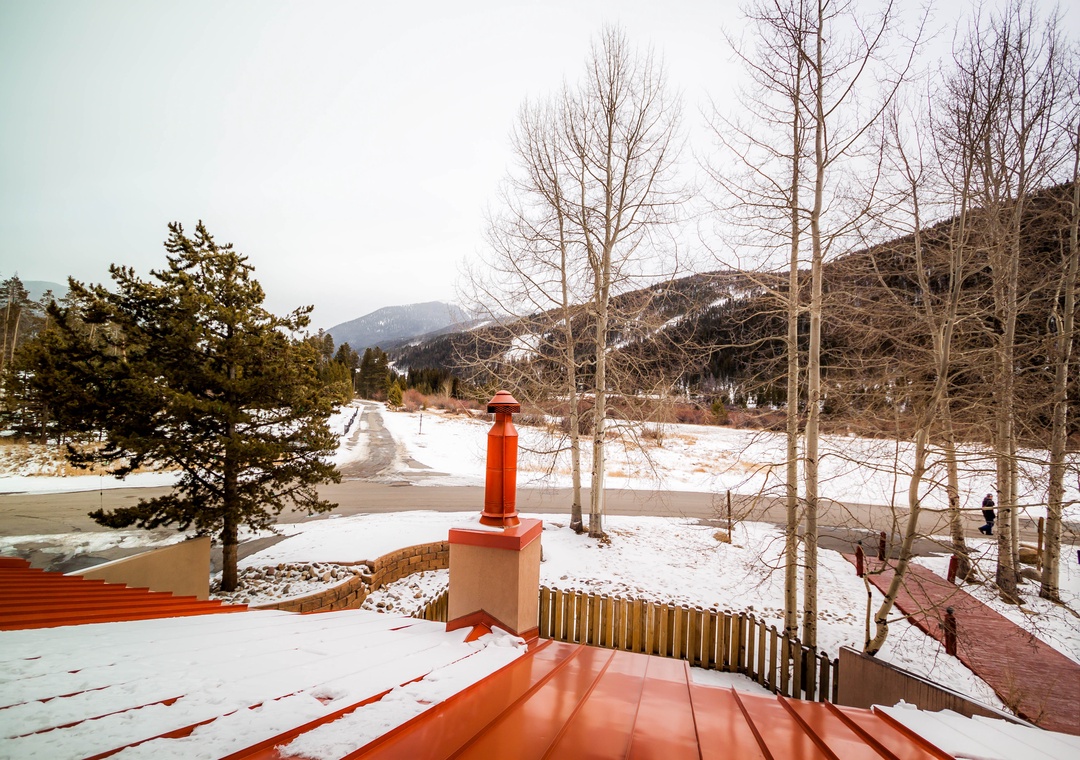 Snow-covered mountain landscape surrounds this peaceful winter retreat, offering a serene backdrop for your getaway.