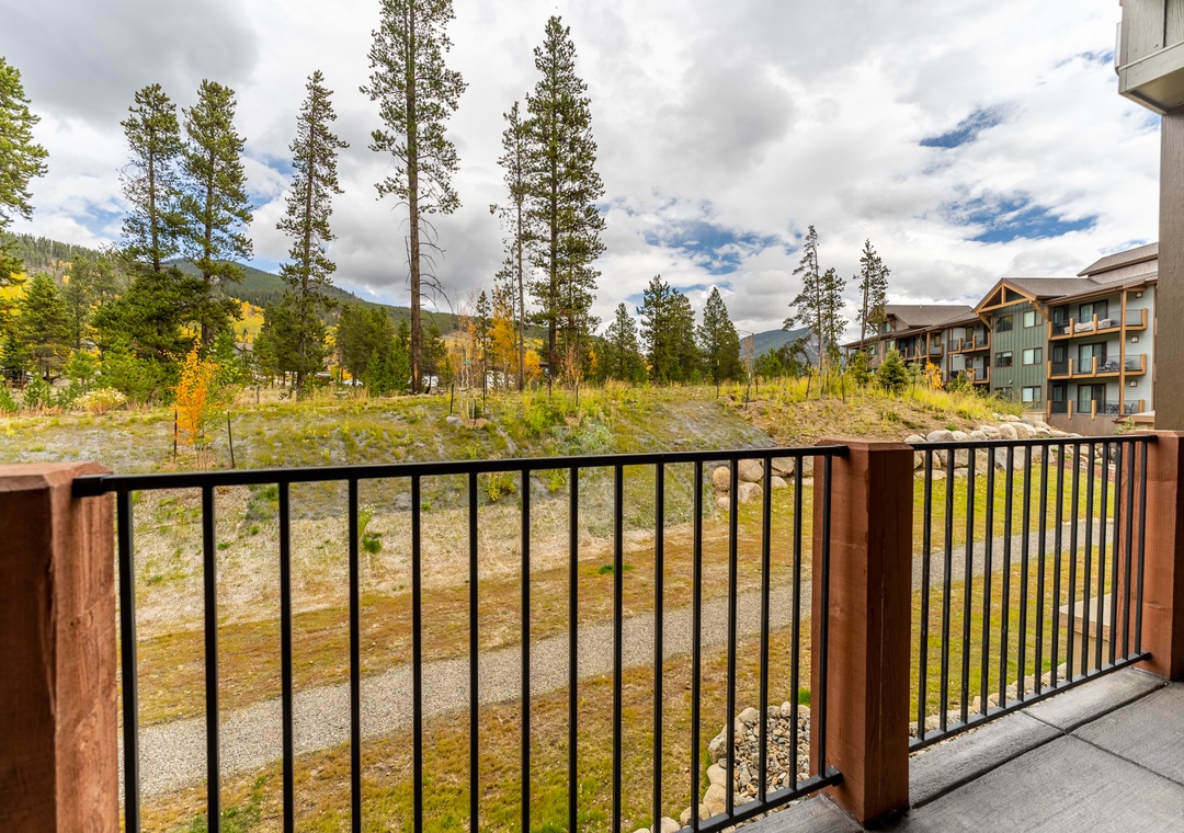 Step onto your private balcony and breathe in the crisp mountain air while golden autumn trees frame this peaceful landscape view.