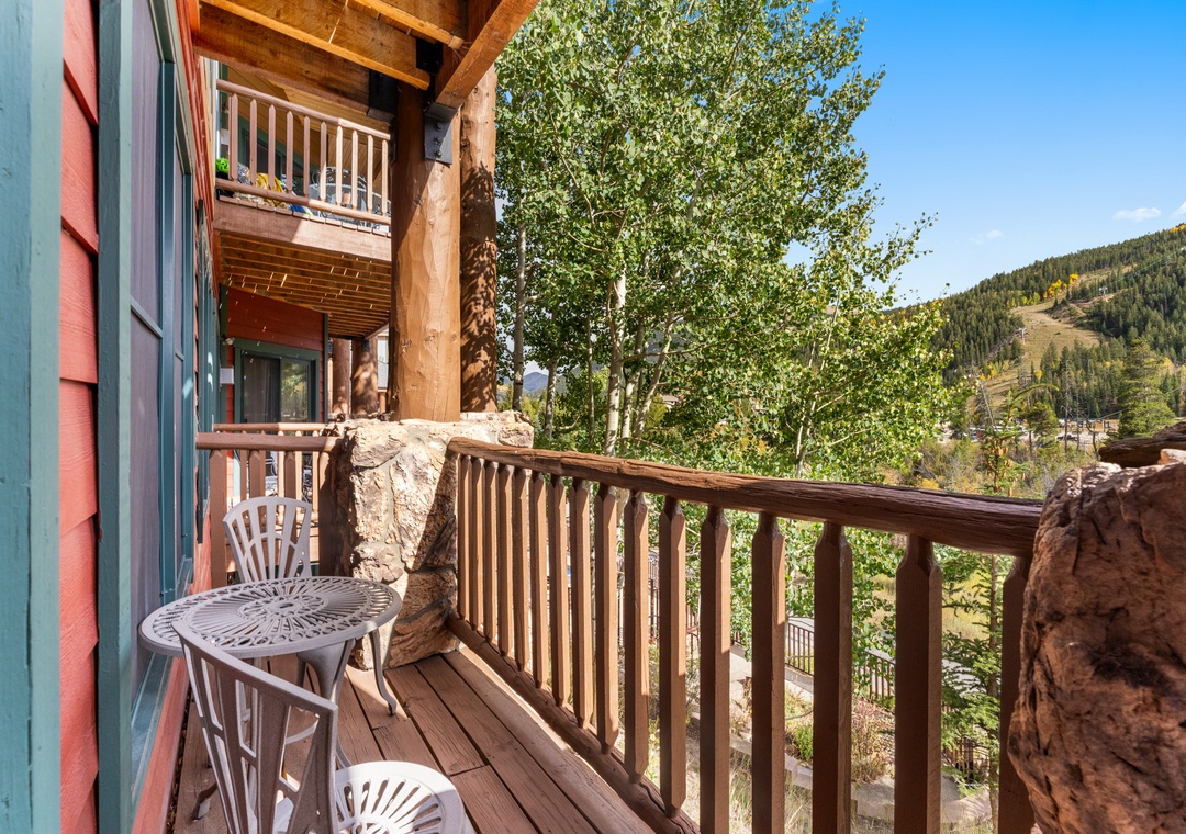 Step onto your private balcony to breathe in fresh mountain air and soak up stunning valley views from your cozy retreat.