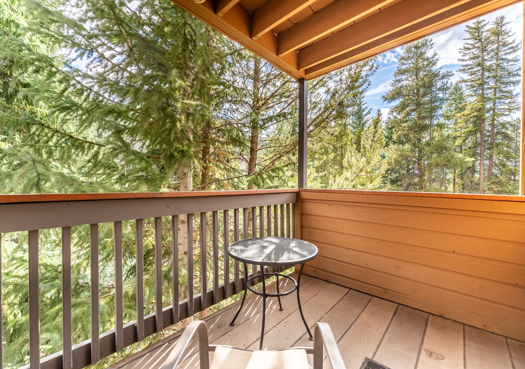 Sip your morning coffee while surrounded by towering evergreens from your private covered balcony.