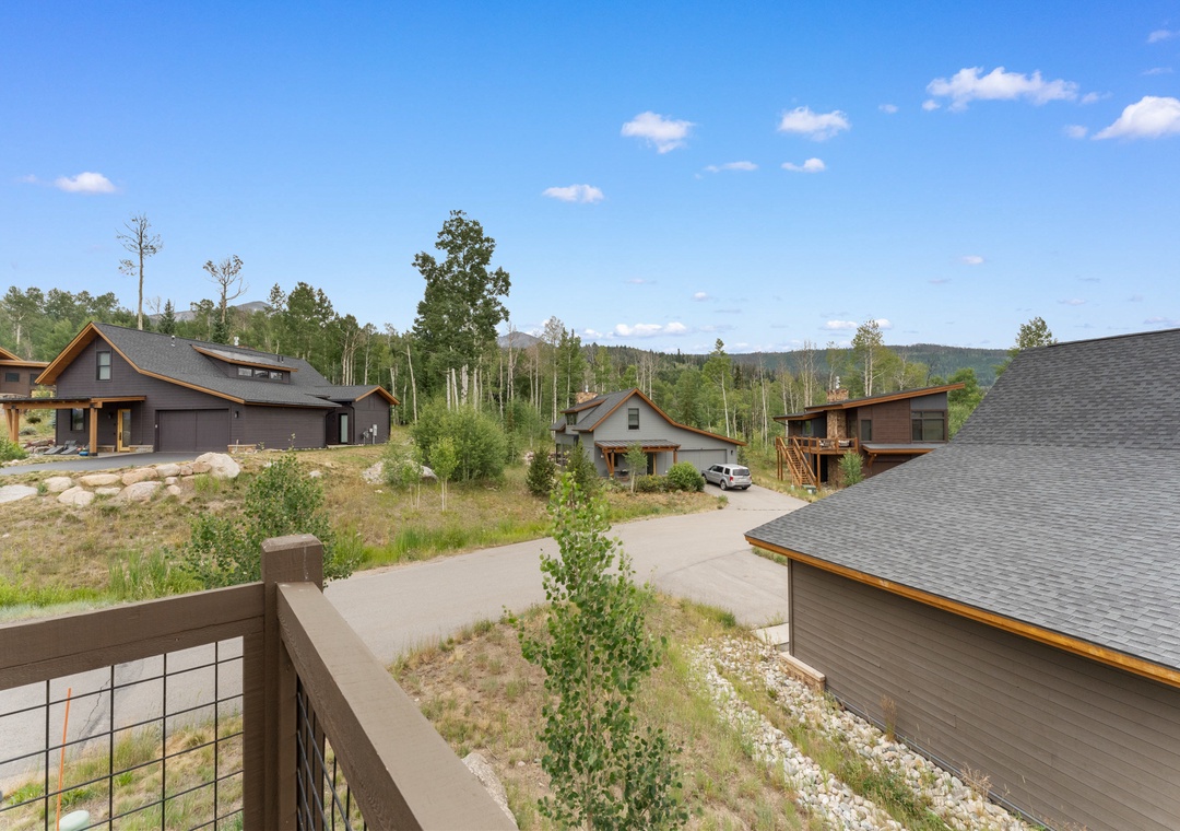 Modern mountain retreat community nestled among aspen groves with stunning forest and hillside views under endless Colorado skies.