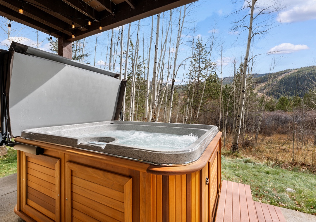 Soak beneath the aspen trees while gazing at mountain vistas from your private hot tub—the perfect retreat after a day exploring the surrounding wilderness.
