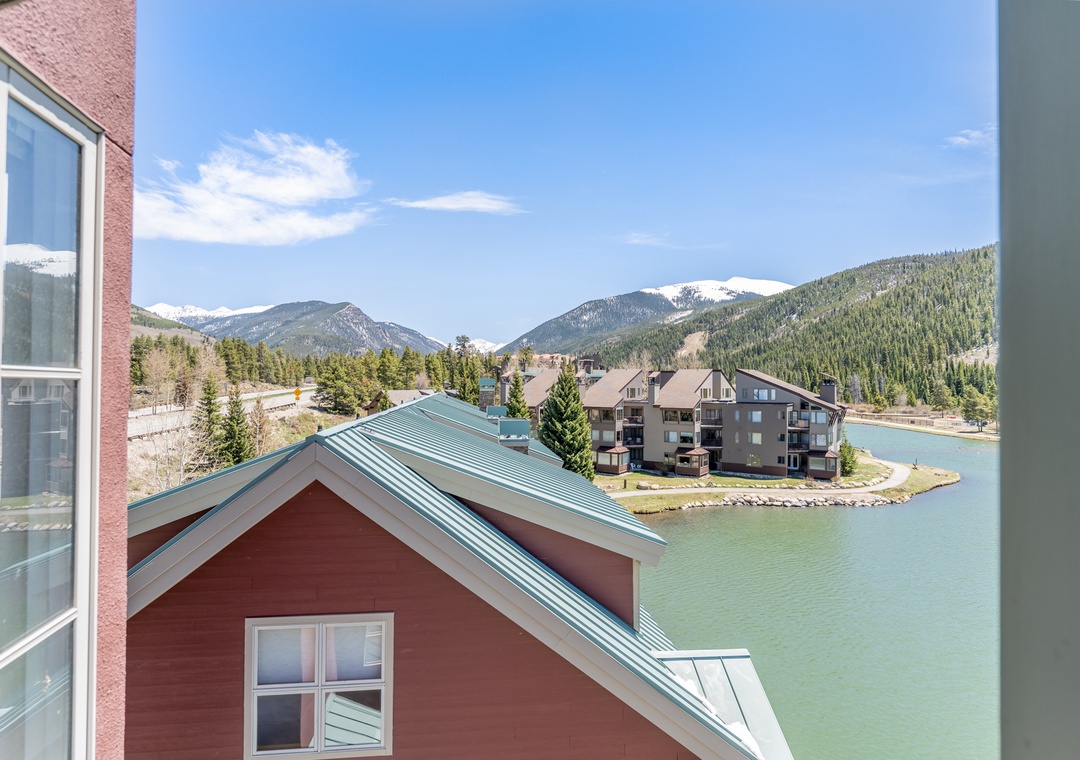 Spectacular lakefront view from the property showcases snow-capped mountains and pristine alpine waters in this scenic mountain resort destination.