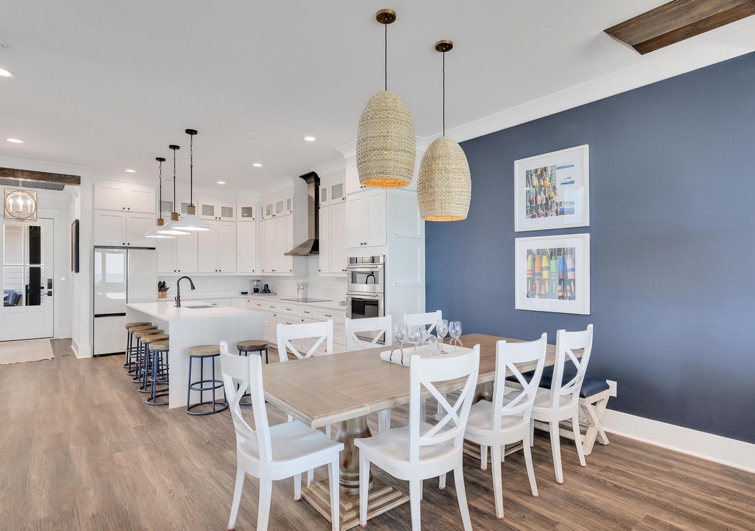 Gather your crew at this spacious dining table or chat at the kitchen island—your bright, open-plan space invites easy conversation and memorable meals together.