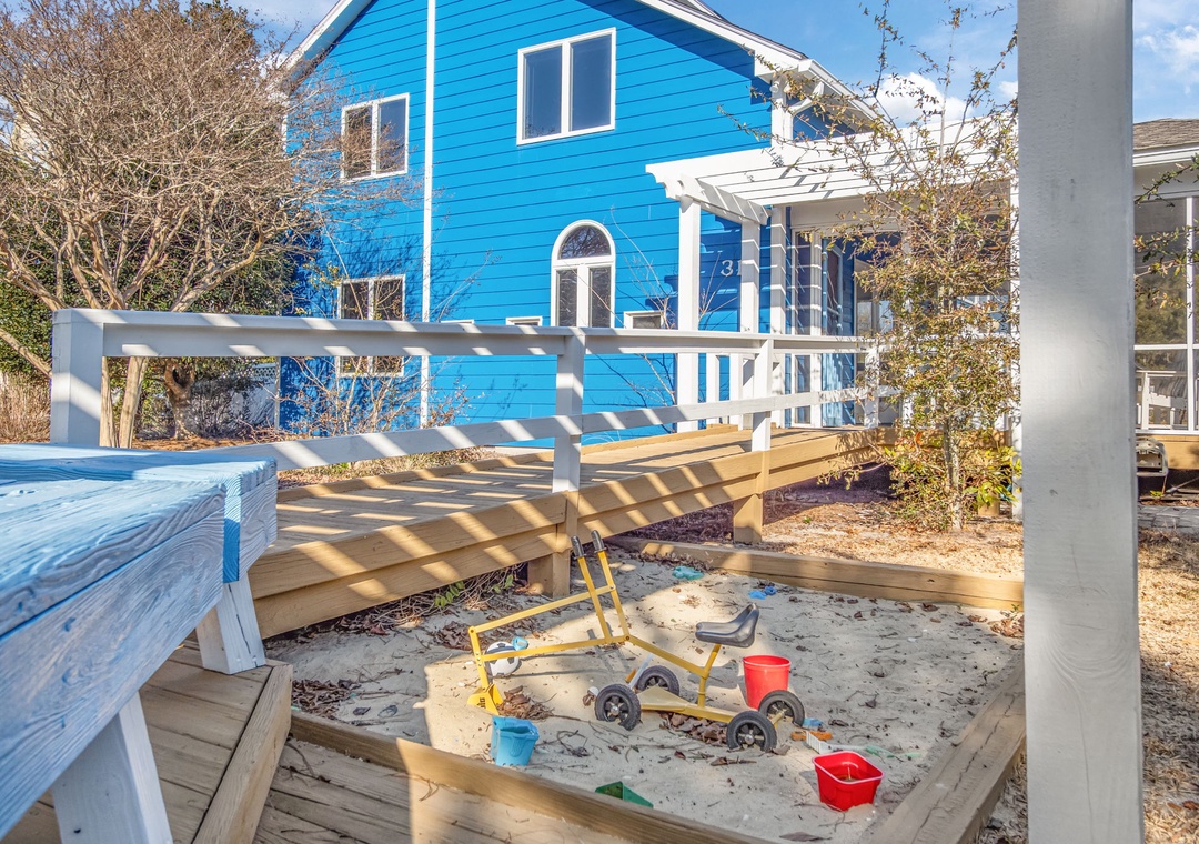 Watch your little ones build sandcastles and explore safely in this dedicated sandbox beneath the sunny deck.