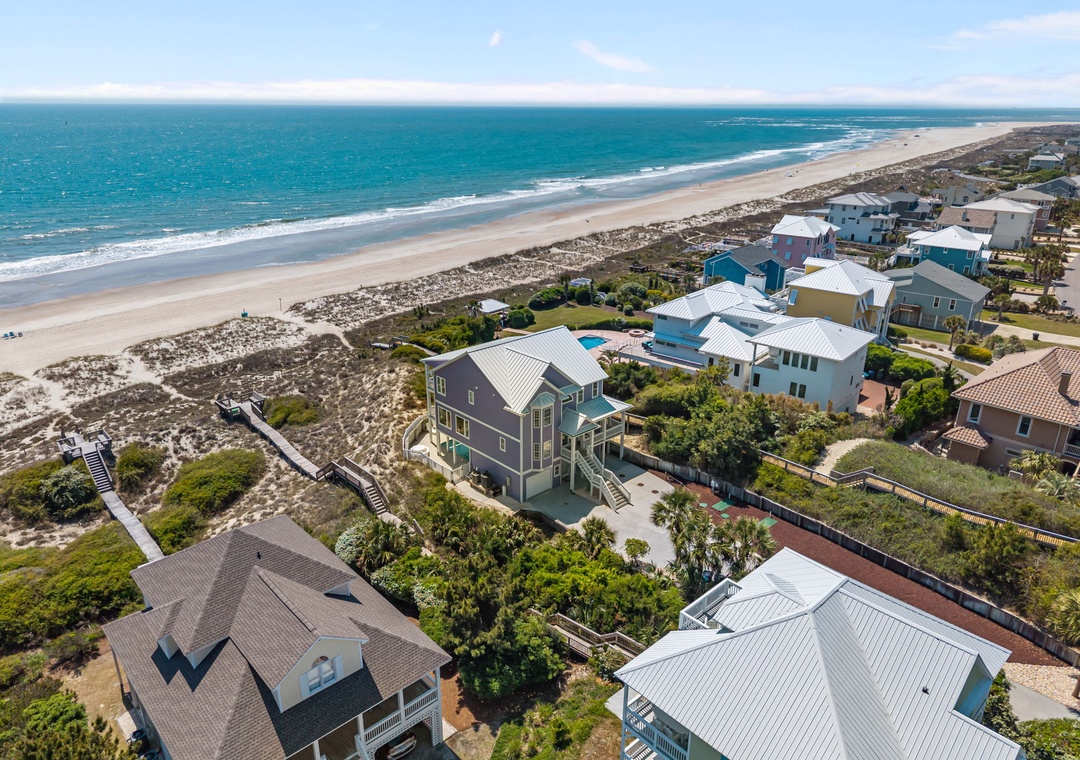 Stunning beachfront community with pristine sandy shores and turquoise waters stretching endlessly along the coast.