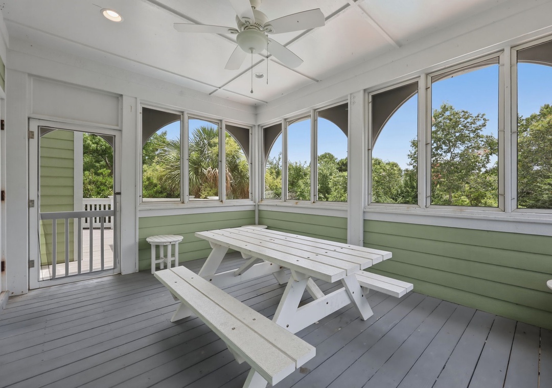 Your screened porch invites you to unwind with treetop views, a ceiling fan for gentle breezes, and a cozy picnic table perfect for morning coffee or sunset gatherings.