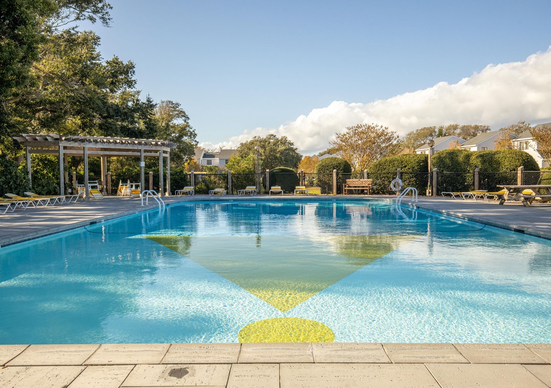 Sparkling pool surrounded by lush gardens and comfortable loungers awaits your perfect poolside retreat.