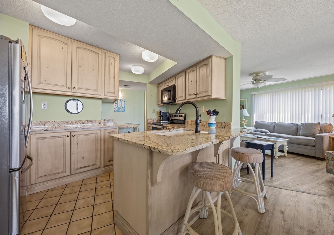 Your fully-equipped kitchen and cozy living space flow together perfectly, creating the ideal spot for preparing meals and unwinding after beach days.