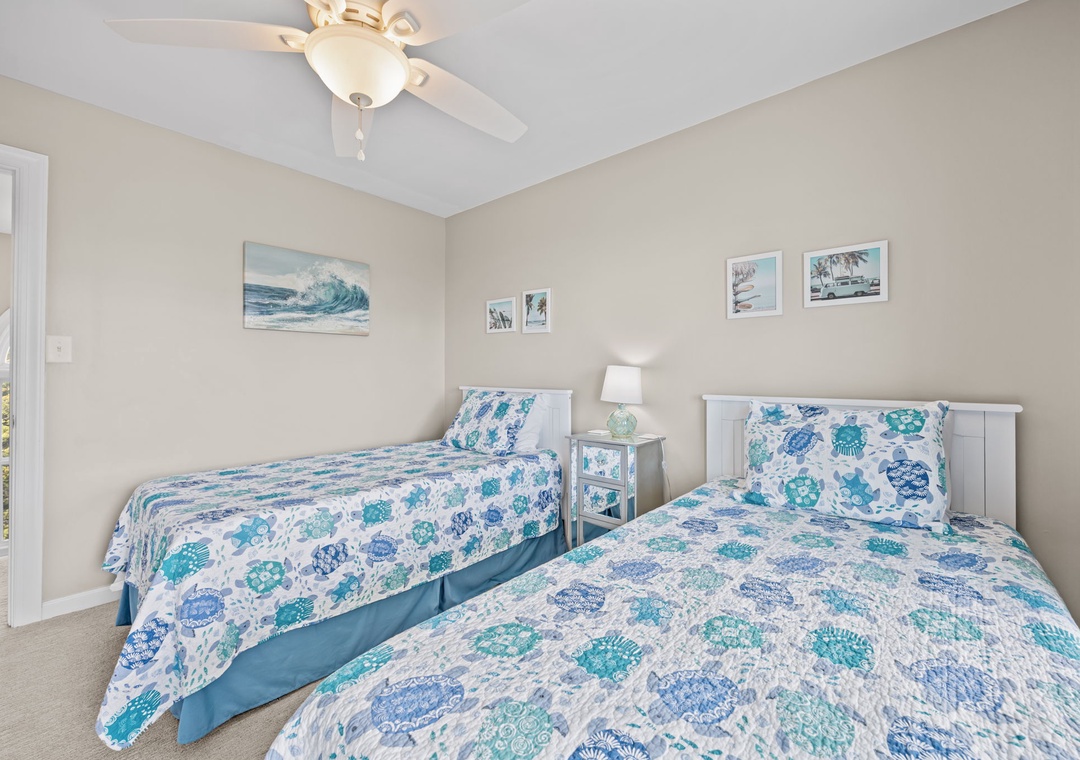 Drift off in this peaceful twin bedroom where coastal blues and soft whites create your perfect seaside retreat.