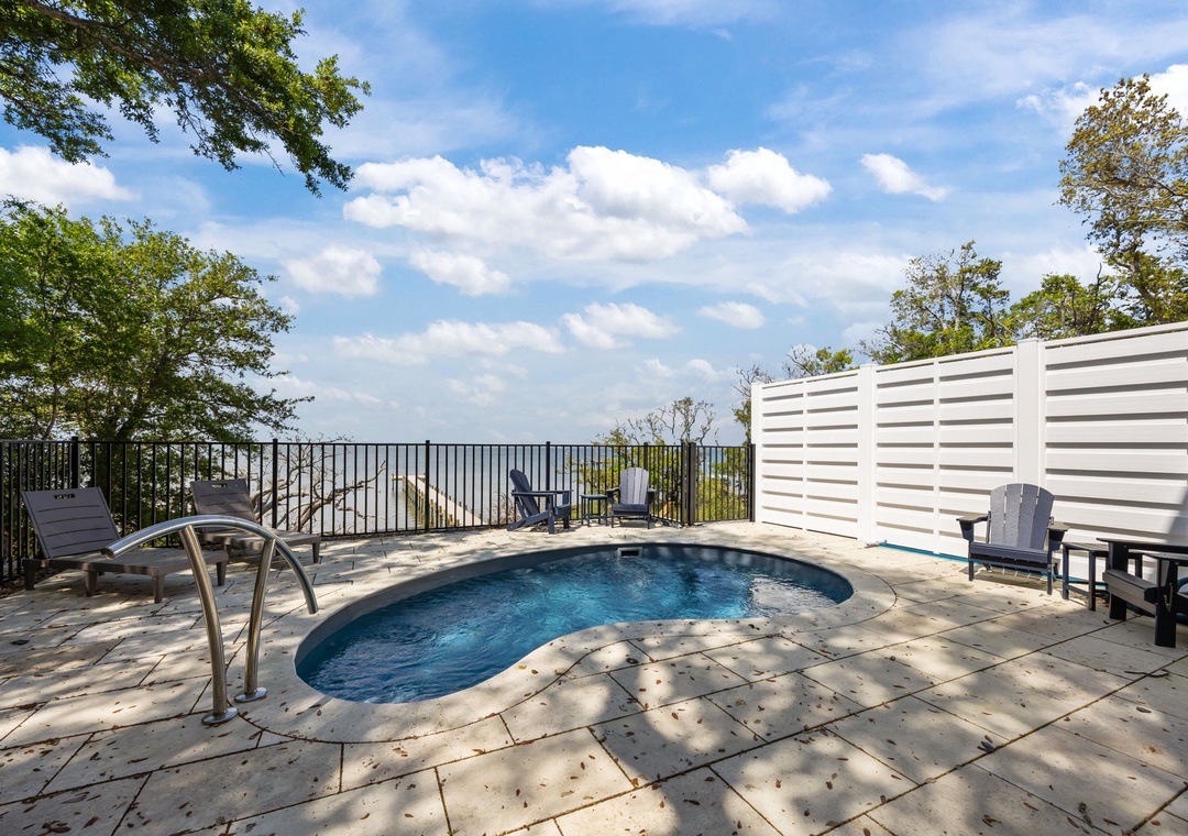 Soak in your private pool while enjoying stunning water views from this secluded deck retreat.