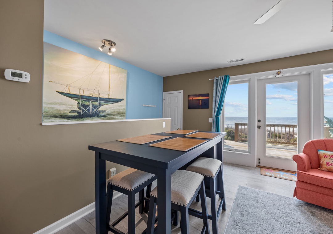 Enjoy ocean views from your dining area where coastal artwork sets the perfect beachside mood for meals.