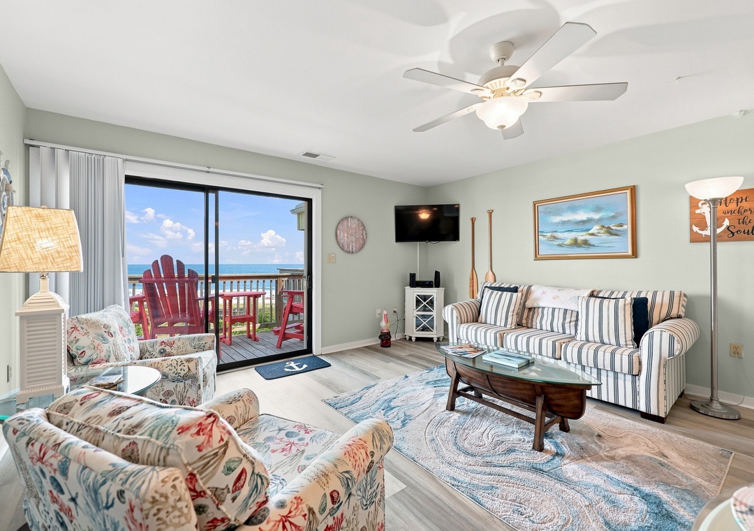 Char’s Cozy Condo | Living Area and Balcony Access