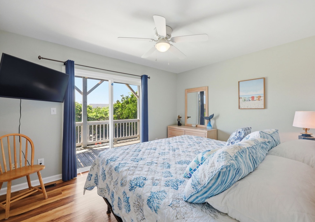 Unwind in your coastal-inspired bedroom where soft blue linens and ocean breezes through the balcony create your perfect retreat.