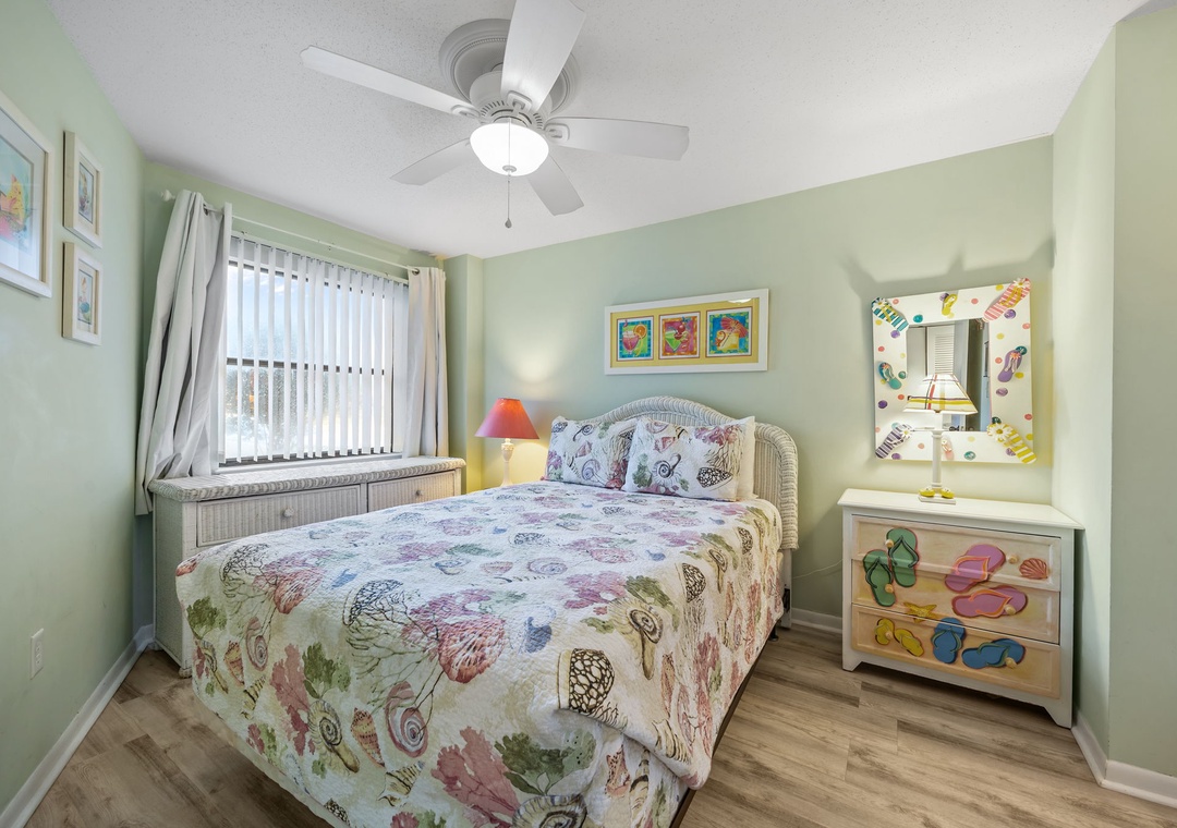Your cozy bedroom features a sea-life themed bed and cheerful decor, creating the perfect coastal retreat for restful nights.