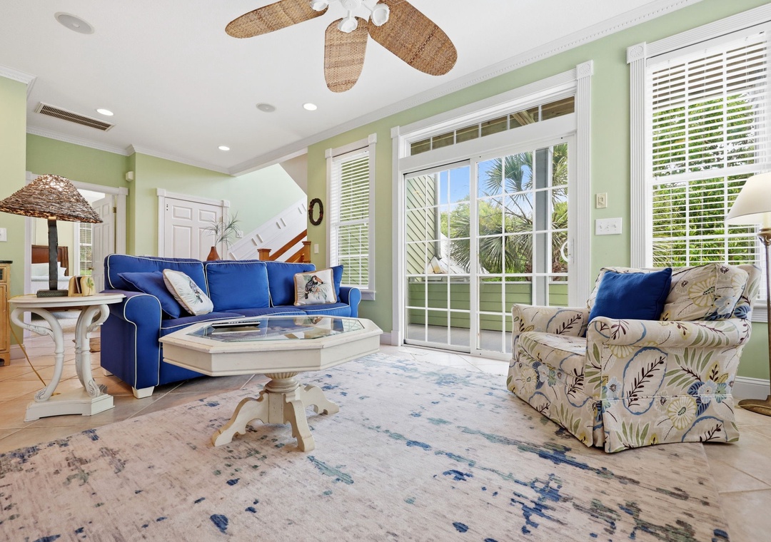 Relax into island-inspired comfort where coastal breezes and sunshine fill your living space. Plush seating invites unwinding after exploring, while tropical views frame your peaceful retreat.