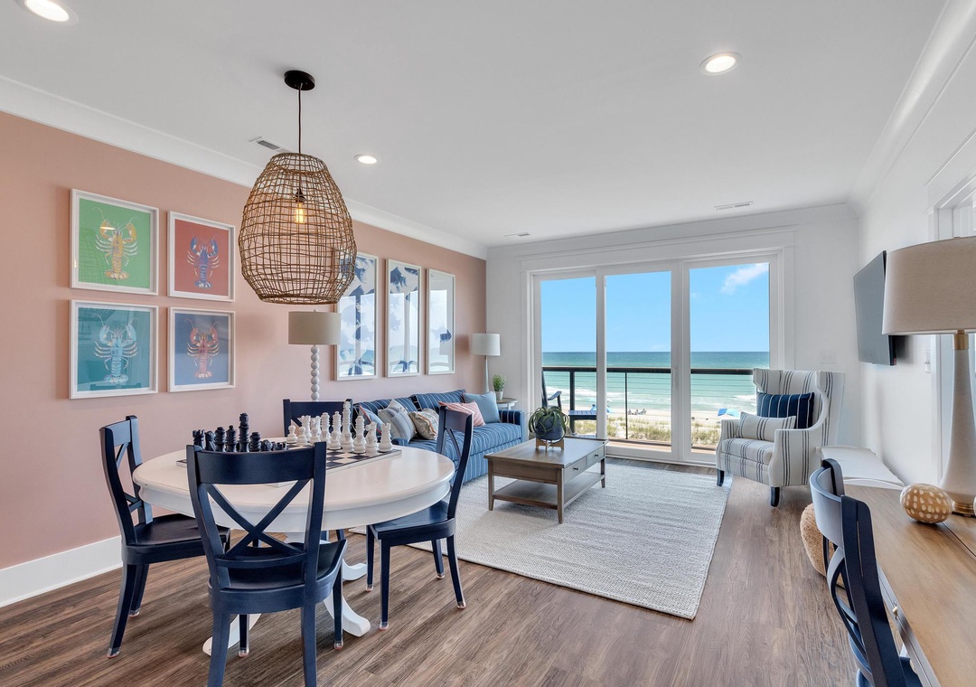 Picture yourself enjoying morning coffee with stunning ocean views through floor-to-ceiling windows, relaxing in the coastal-chic living space where beach meets comfort.