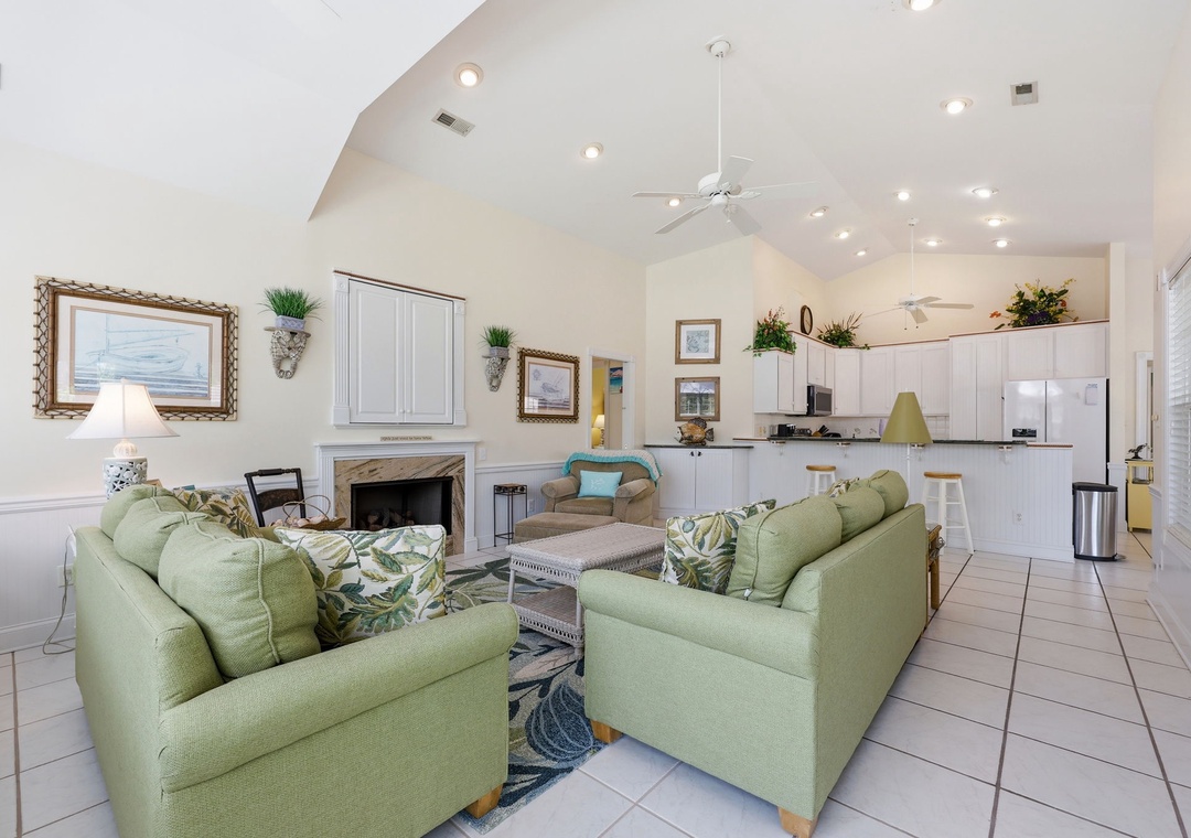 Settle into the cozy living room with vaulted ceilings and coastal touches, or whip up a meal in the fully-equipped kitchen—your home away from home awaits.