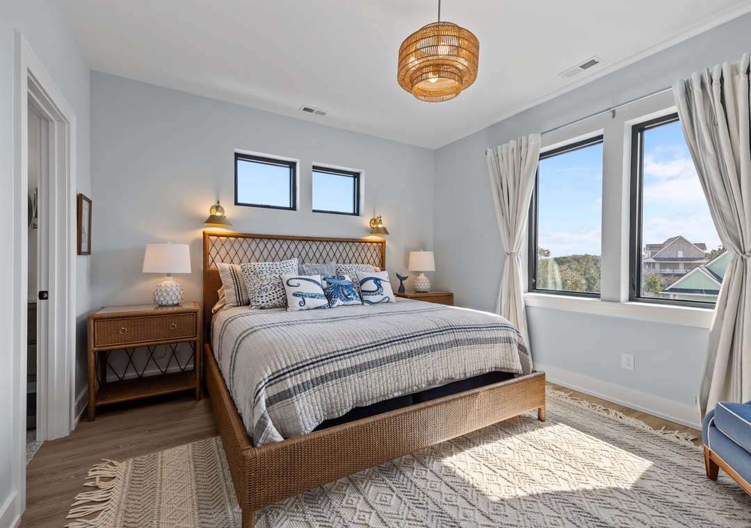 Drift to sleep in your peaceful retreat with natural textures, soft linens, and serene views framing your restful escape.