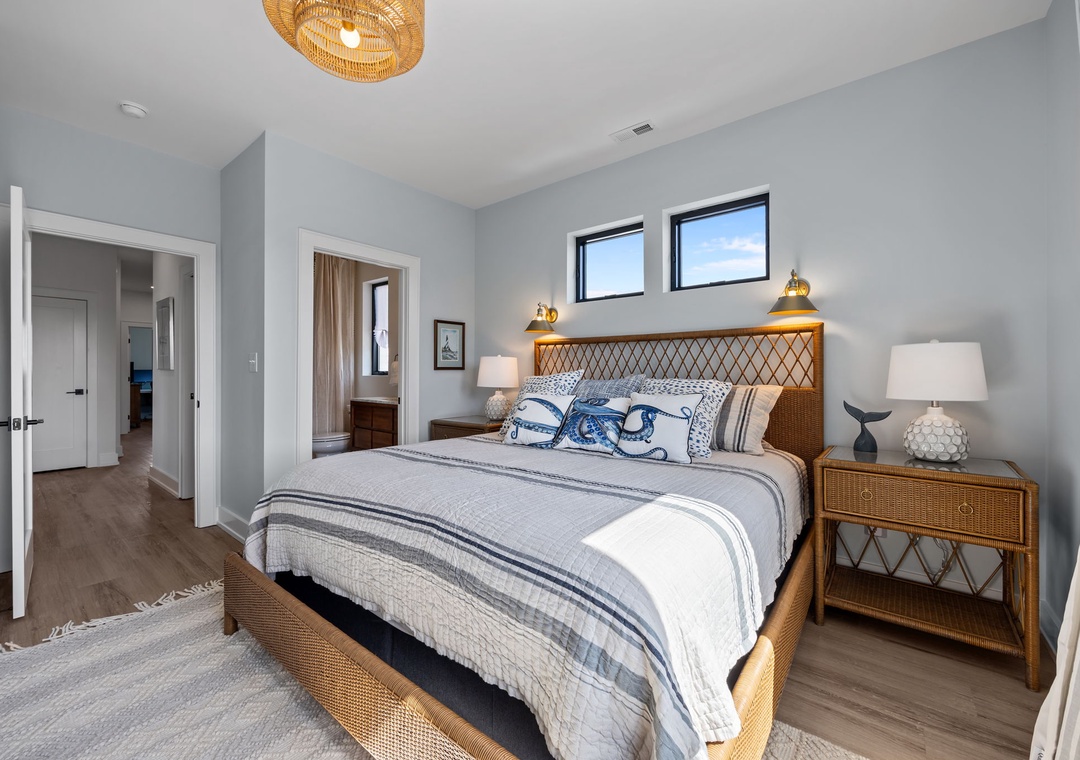 Drift into peaceful sleep in your coastal-inspired bedroom, featuring beautiful natural textures and ocean-themed linens that create a serene retreat.