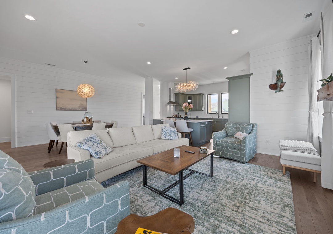 Unwind in your stylish living space featuring coastal-inspired décor, soft textures, and an open layout connecting to your gourmet kitchen.