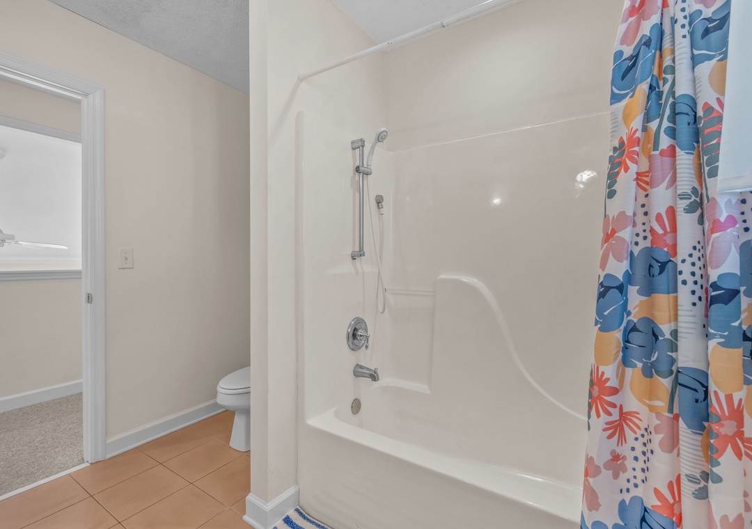 Refresh in your bright bathroom with a deep soaking tub, perfect for unwinding after long beach days.