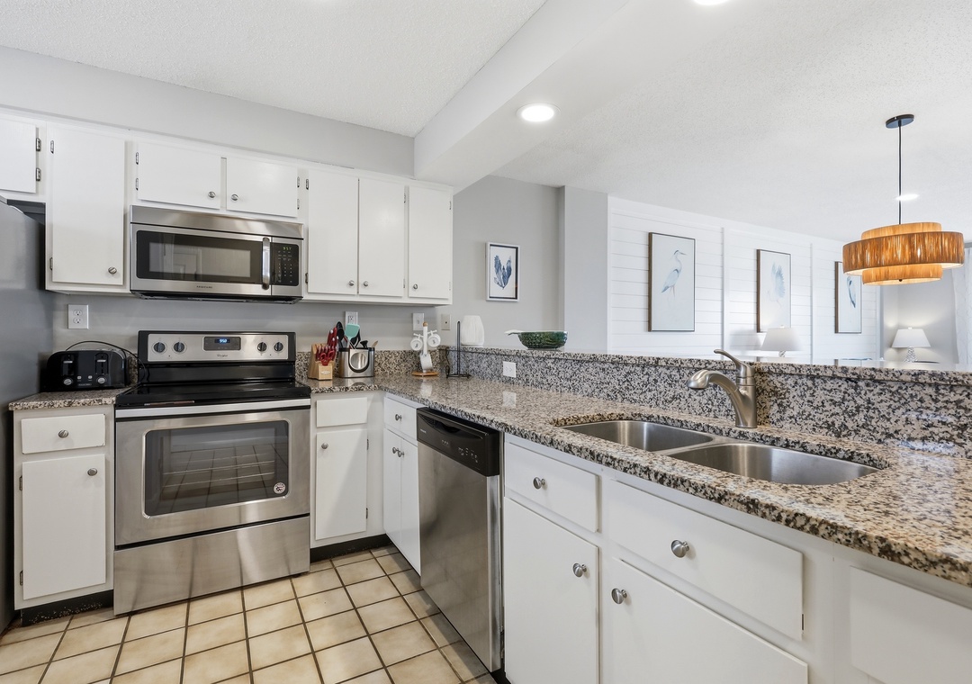 Your fully equipped kitchen features granite countertops, stainless steel appliances, and everything you need to prepare meals during your stay.