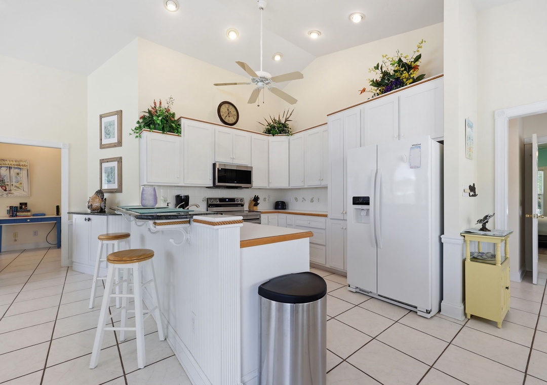 Picture yourself preparing meals in this bright, fully-equipped kitchen with an island—perfect for morning coffee or gathering with your group to plan the day's adventures.