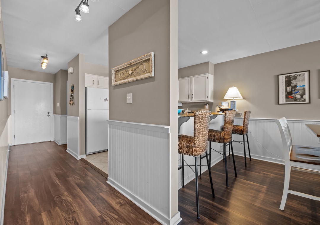 Your open-plan kitchen flows seamlessly into the dining area, perfect for morning coffee or evening meals with friends.