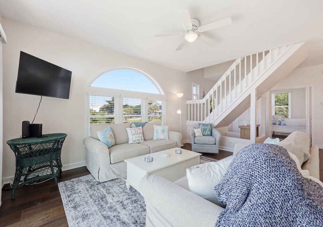 Settle into your bright coastal retreat with plush seating, ocean-inspired touches, and a breezy open layout perfect for unwinding after beach days.