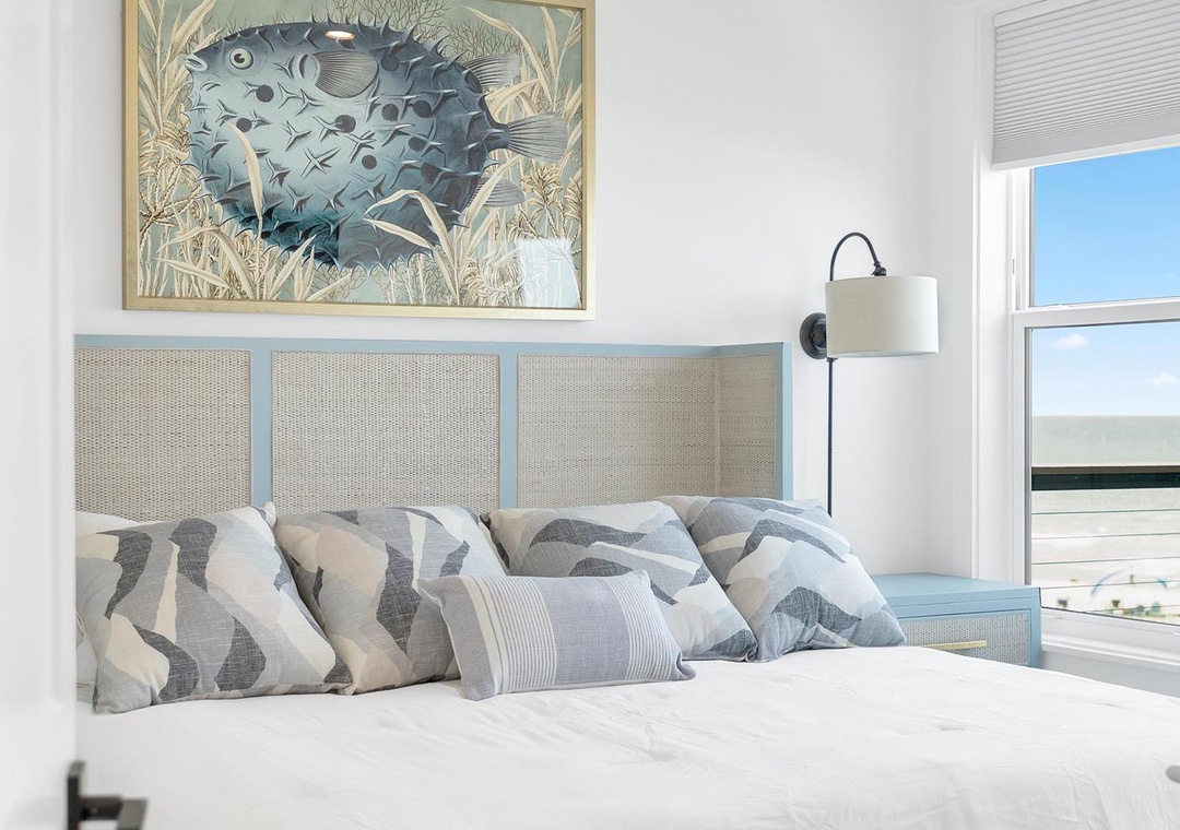 Drift off in this airy coastal bedroom, where ocean-inspired art and soft linens create your perfect seaside sanctuary.