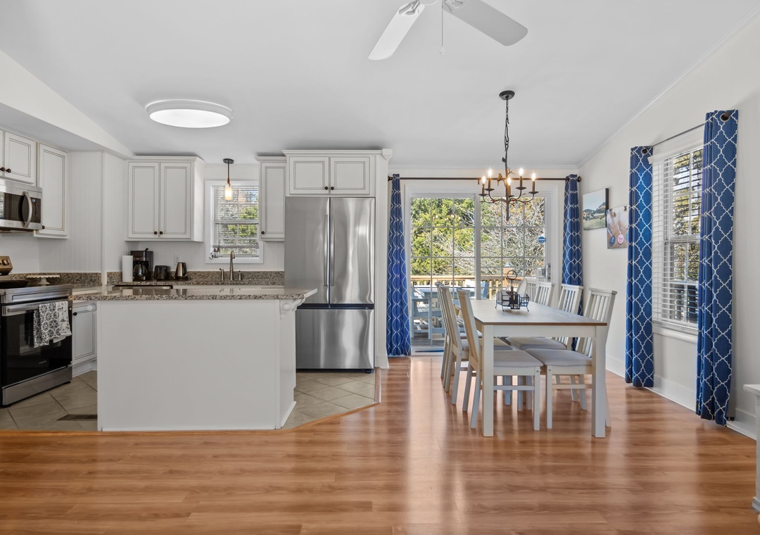 Gather around your spacious open kitchen and dining area, where stainless steel appliances and warm hardwood floors create the perfect space for memorable meals.