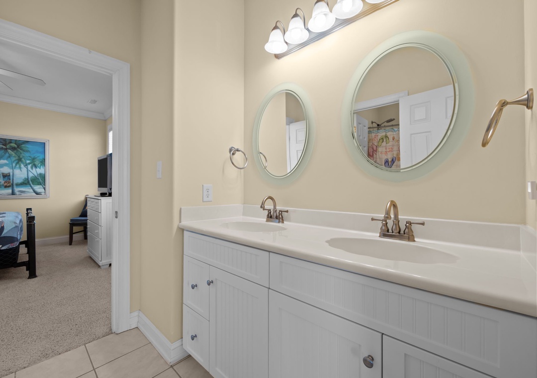 Your spacious double-vanity bathroom offers plenty of room to get ready, with bright lighting and clean lines for a refreshing start to your day.