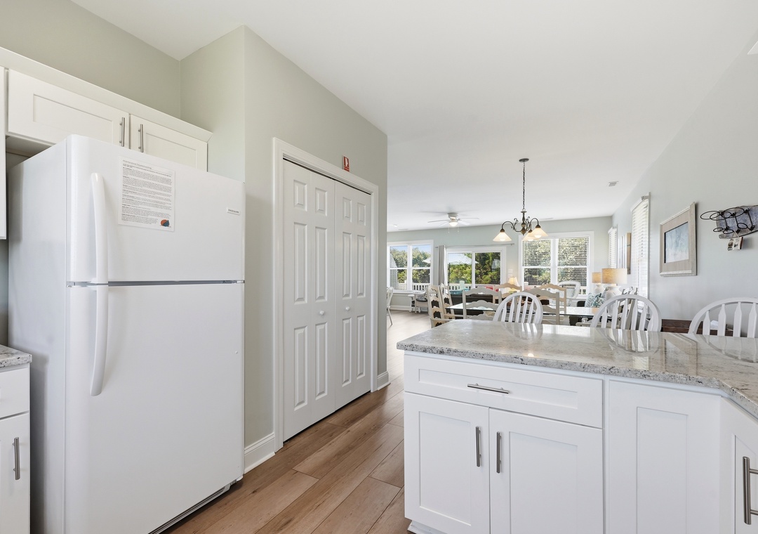 Your bright, fully-equipped kitchen flows into a sunlit dining and living area, perfect for gathering after a day of exploring or unwinding with morning coffee and views.