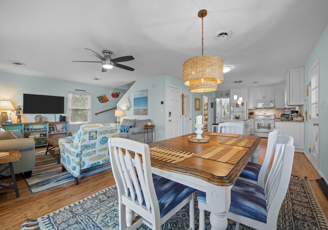 Your coastal haven flows seamlessly from dining to living, where ocean-themed decor and nautical touches create the perfect beachside retreat.