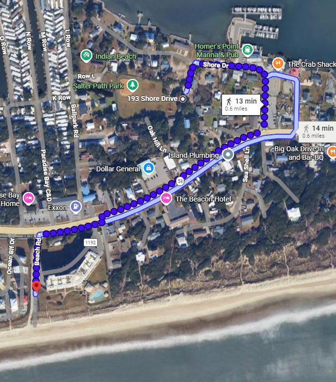 Aerial view of a coastal neighborhood with walking routes to nearby marina, shops, and beach access along Shore Drive.