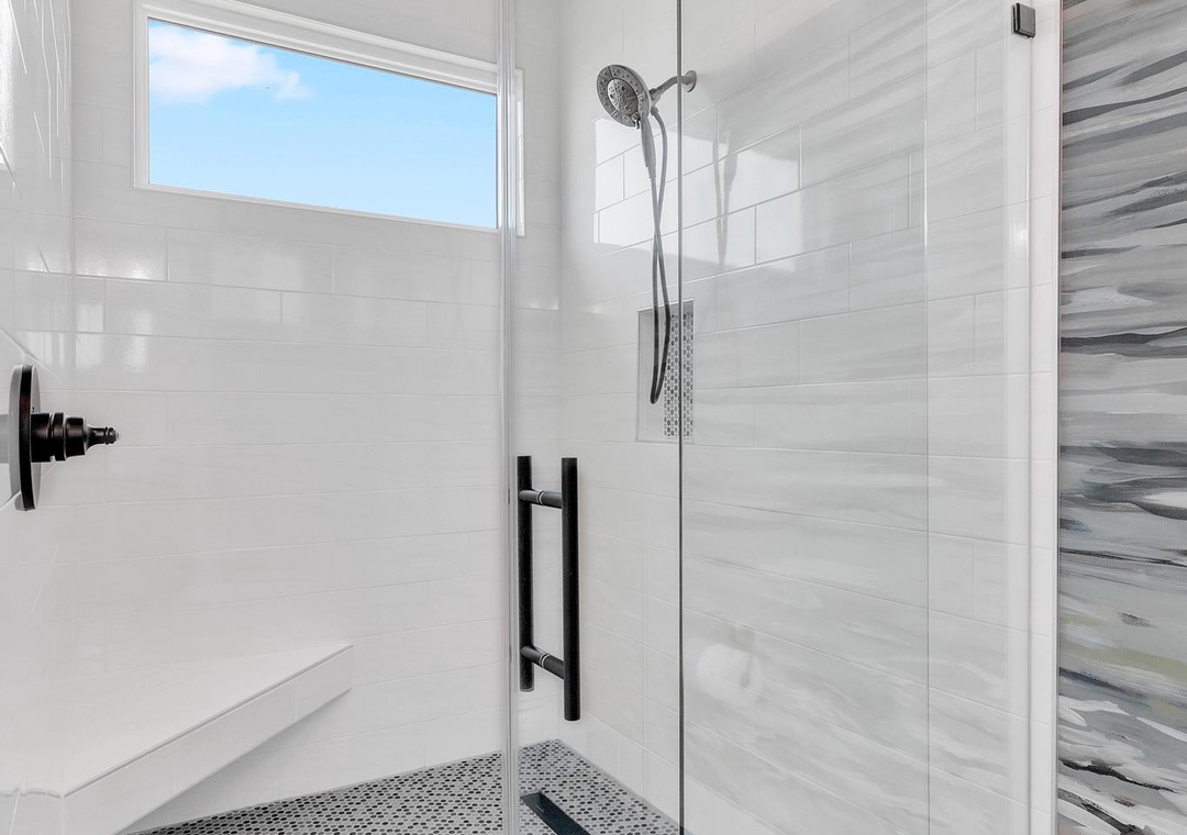 Step into your stylish glass-enclosed walk-in shower with modern fixtures and contemporary tile work that creates a spa-like atmosphere for your daily refresh.