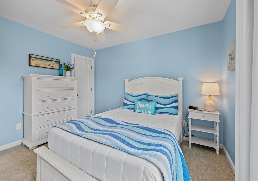 Drift off to peaceful dreams in your cozy coastal retreat, where ocean-inspired blues and crisp white linens create the perfect seaside sanctuary.