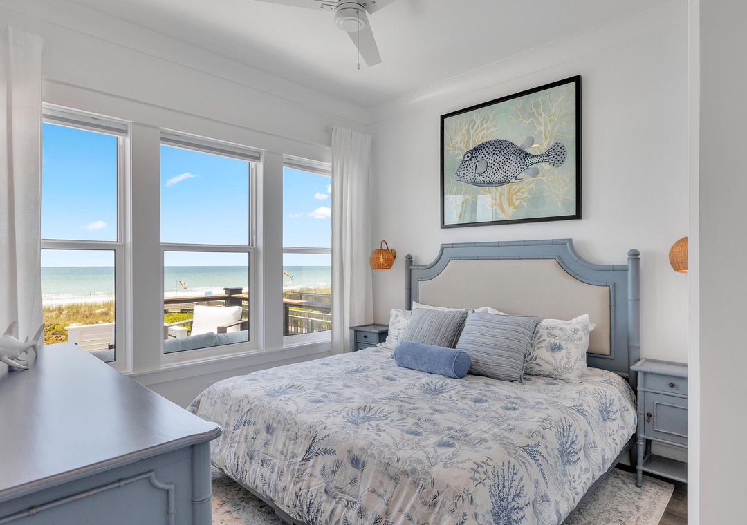 Wake up to breathtaking beachfront views from your serene bedroom, where soft coastal tones and gentle ocean breezes create the perfect retreat after a day by the water.