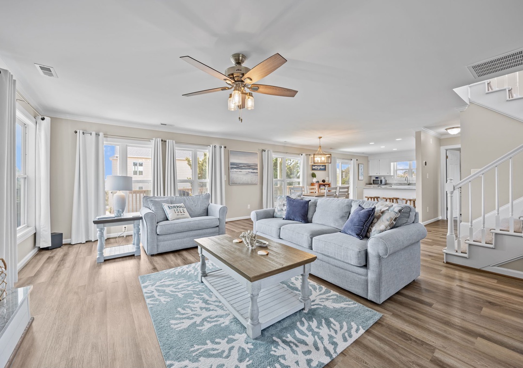 Relax in this bright, open living space where soft coastal colors and plush seating create your perfect retreat.