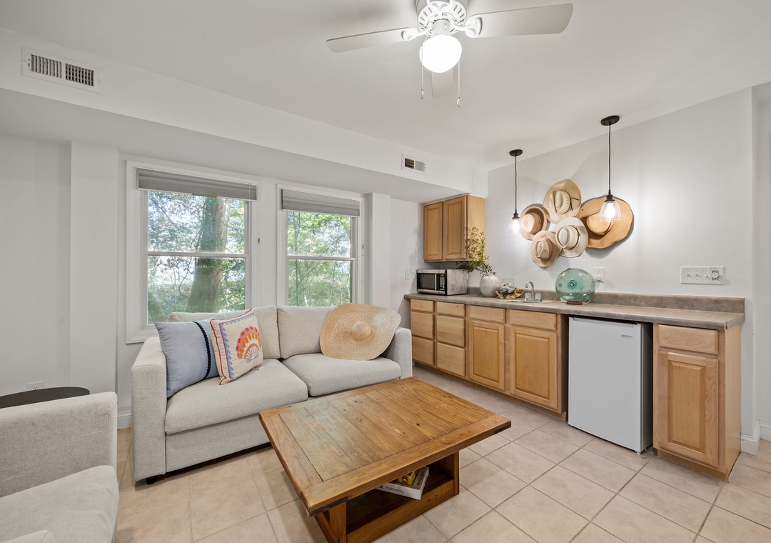 Relax in your bright, open living space where warm wood tones meet modern comfort, perfect for unwinding after exploring.