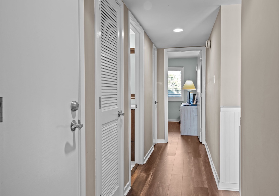 Step into your welcoming hallway with warm hardwood floors and thoughtful storage solutions that lead to bright, comfortable living spaces.