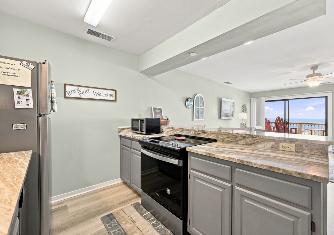Char’s Cozy Condo | Kitchen and Living Area