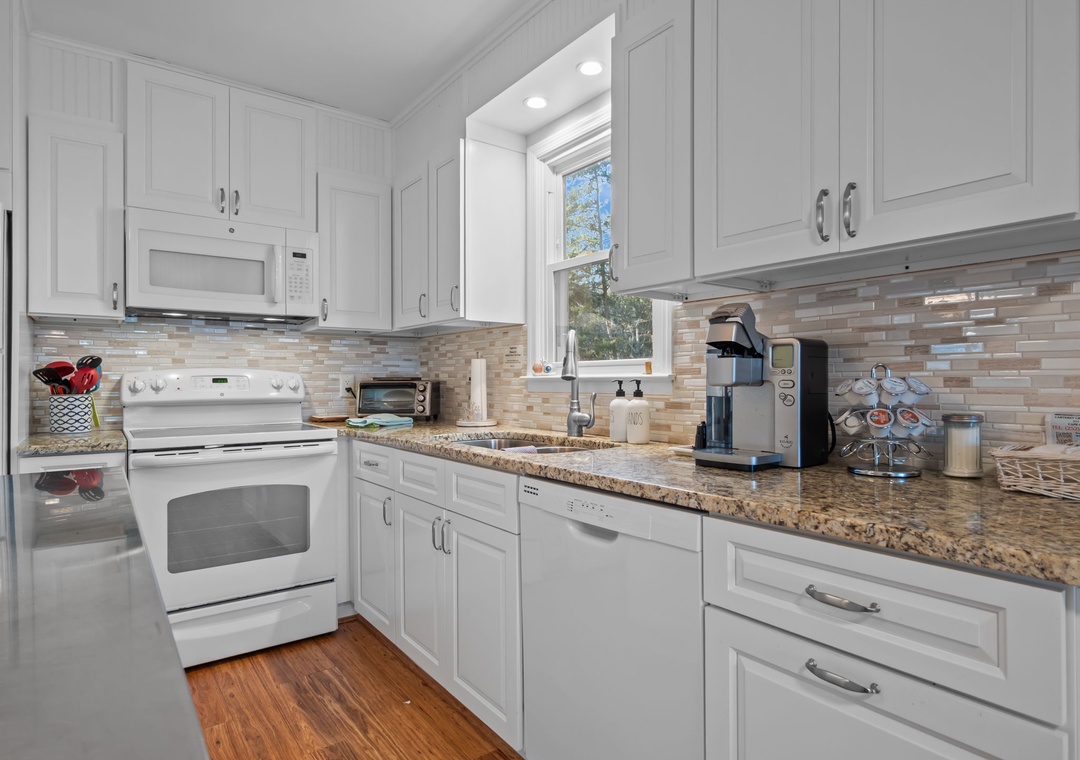 Your fully equipped kitchen features granite counters, modern appliances, and everything you need to create memorable meals during your stay.