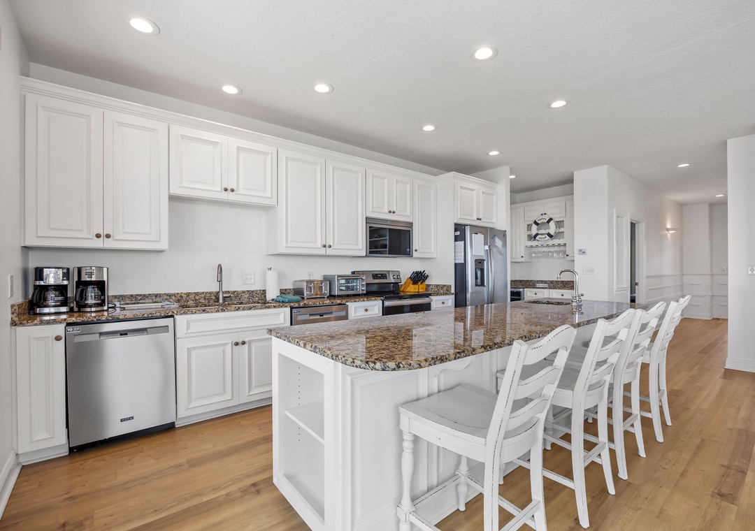 Your gourmet kitchen awaits with granite countertops, stainless appliances, and a spacious island for cooking and gathering together.