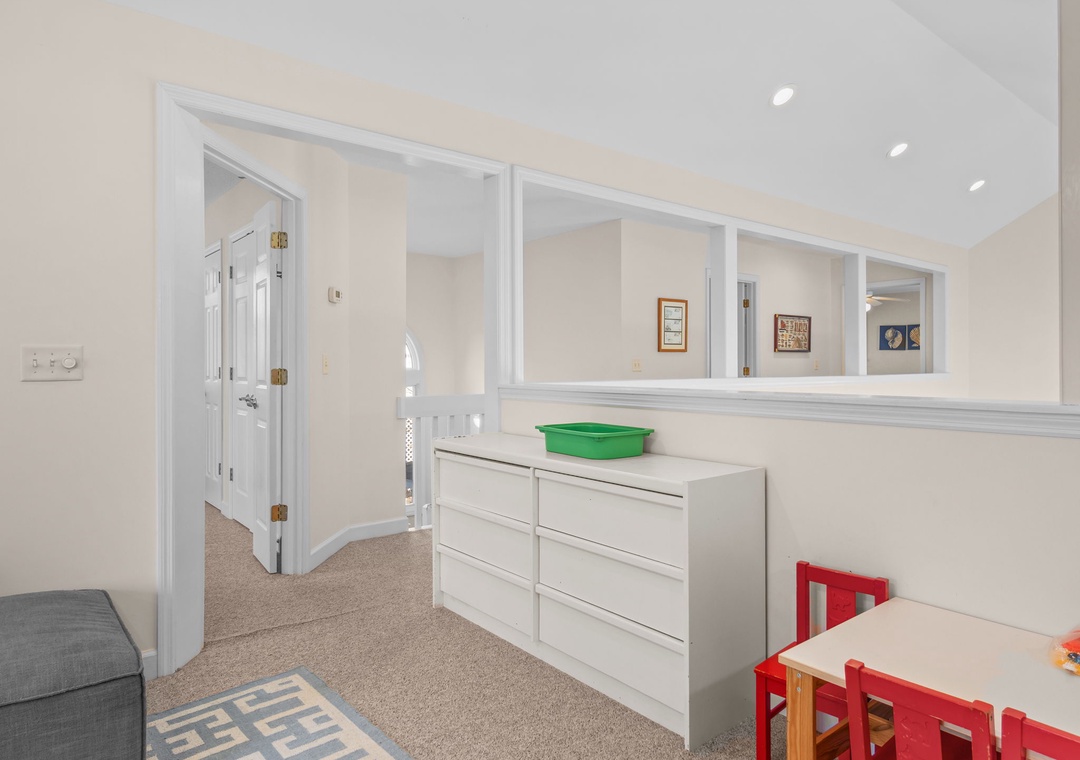 Your family-friendly loft space features plenty of storage and a dedicated kids' area with table and chairs for creative play and activities.