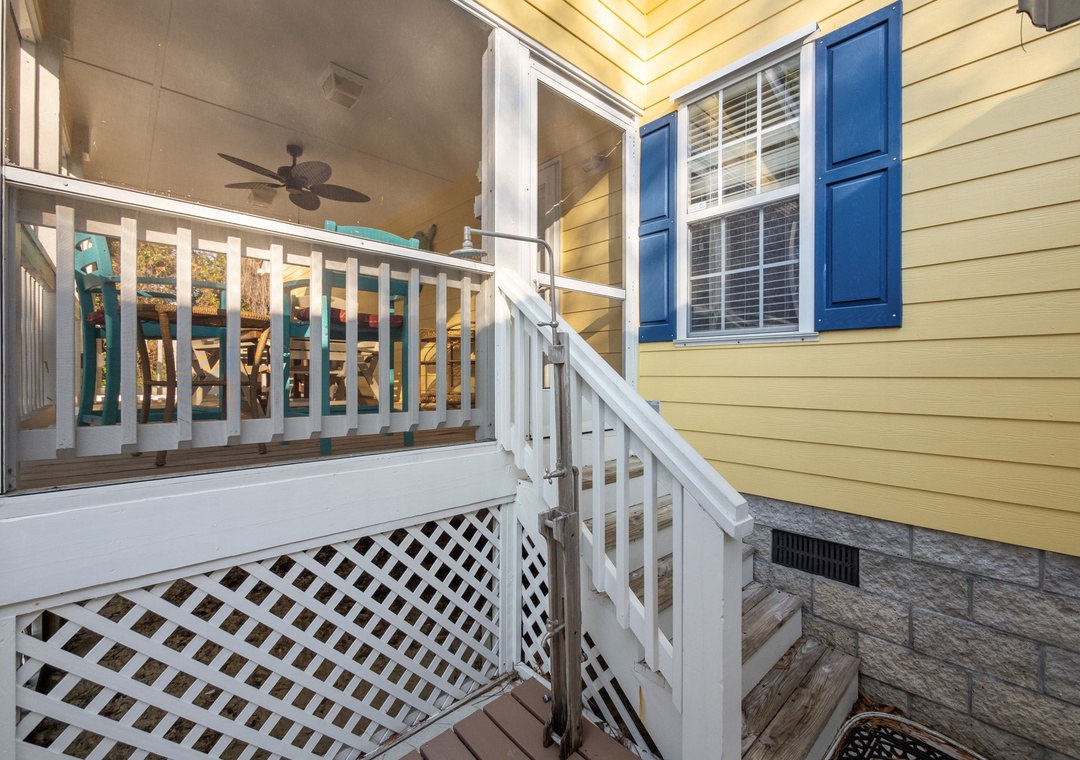 Relax on your private covered balcony with ceiling fan and charming blue shutters, perfect for morning coffee or evening unwinding.